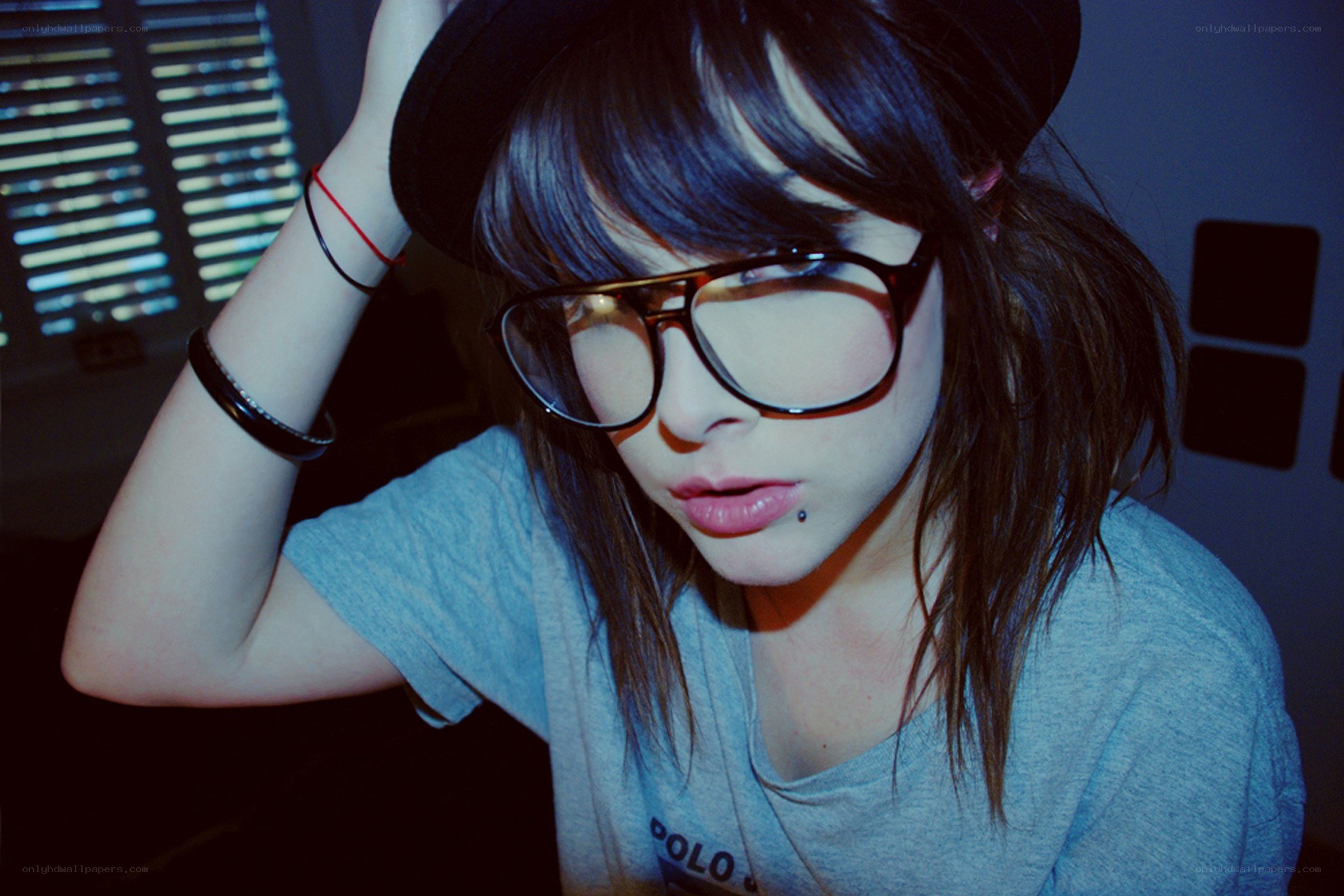 person with glasses and hat