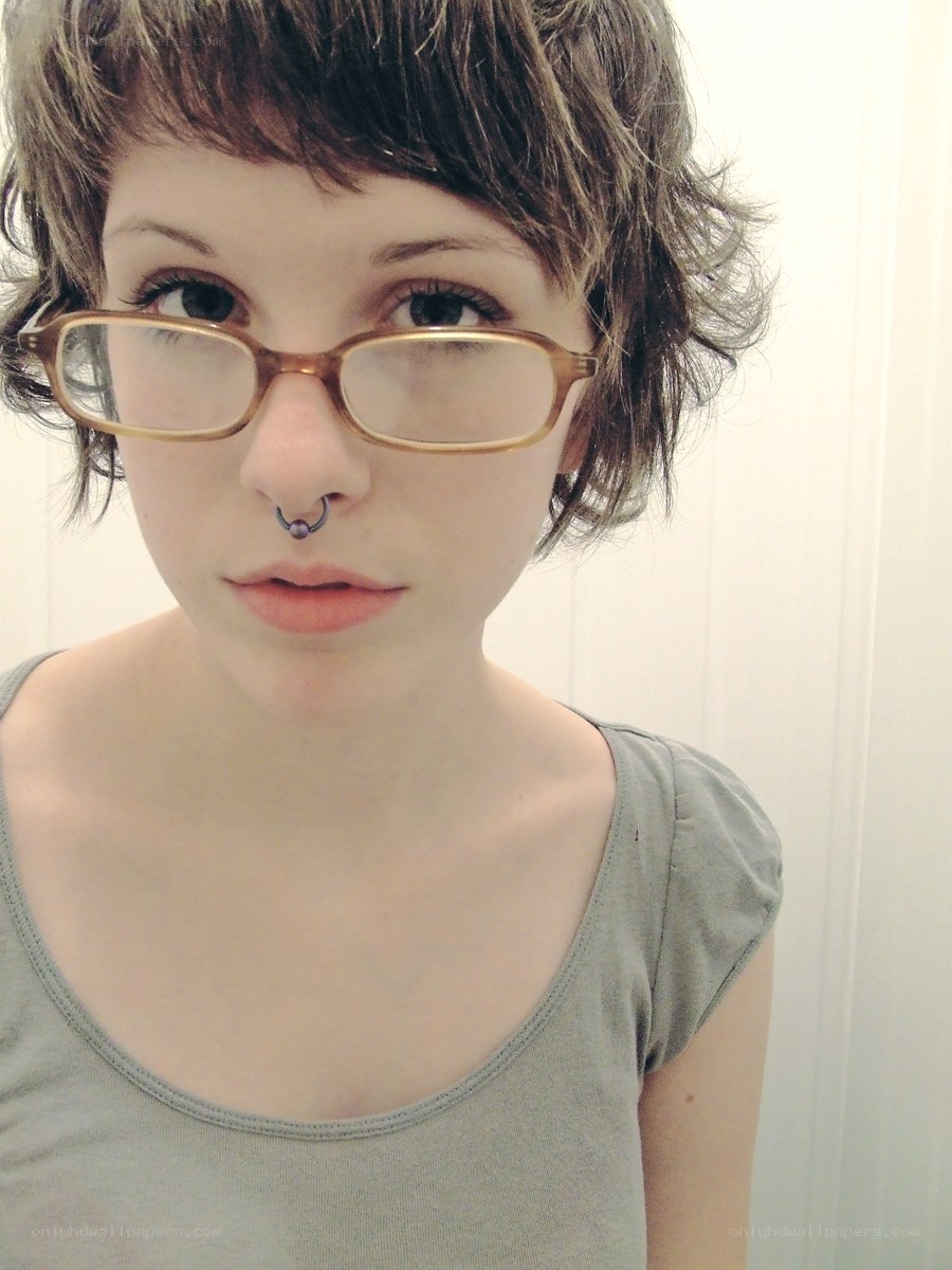 person with glasses and nose ring