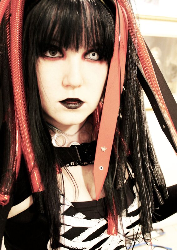 person with goth makeup and costume