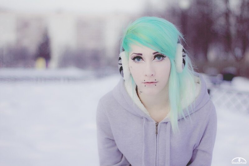 person with green hair in snow