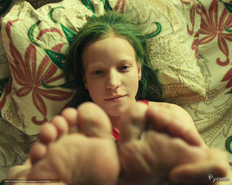 person with green hair lying down