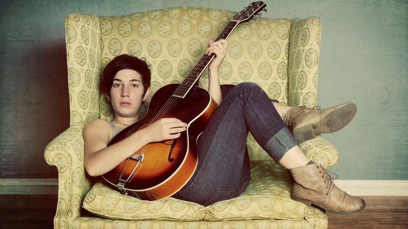 Person with Guitar — Brown