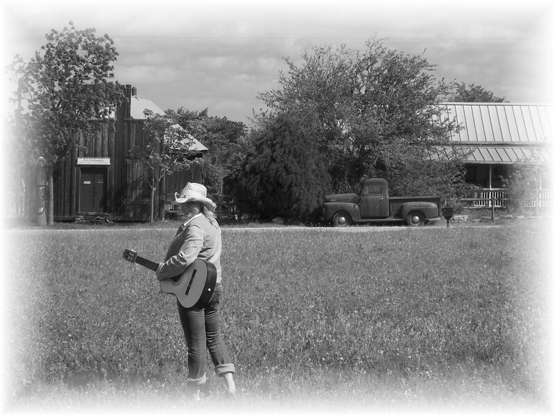 Person with Guitar in Field