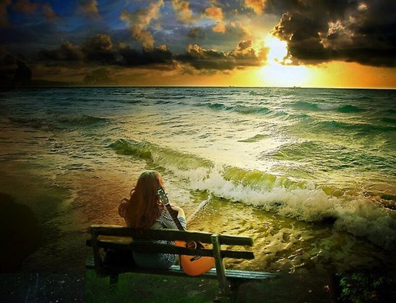 Person with Guitar on Beach
