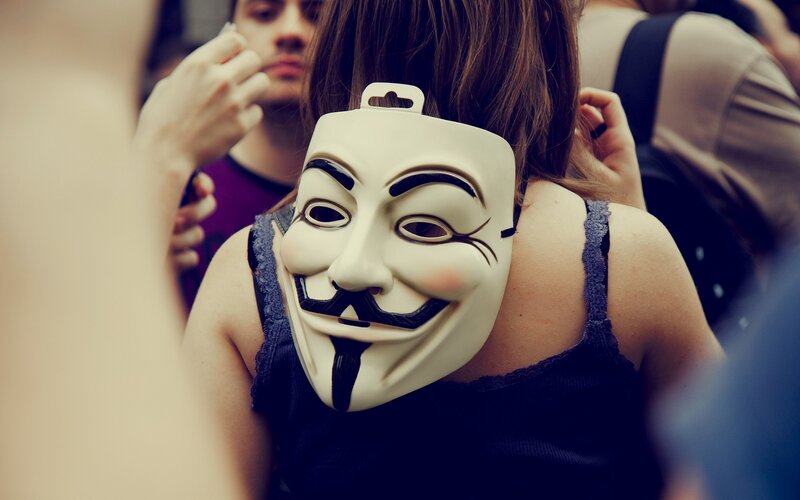 person with guy fawkes mask