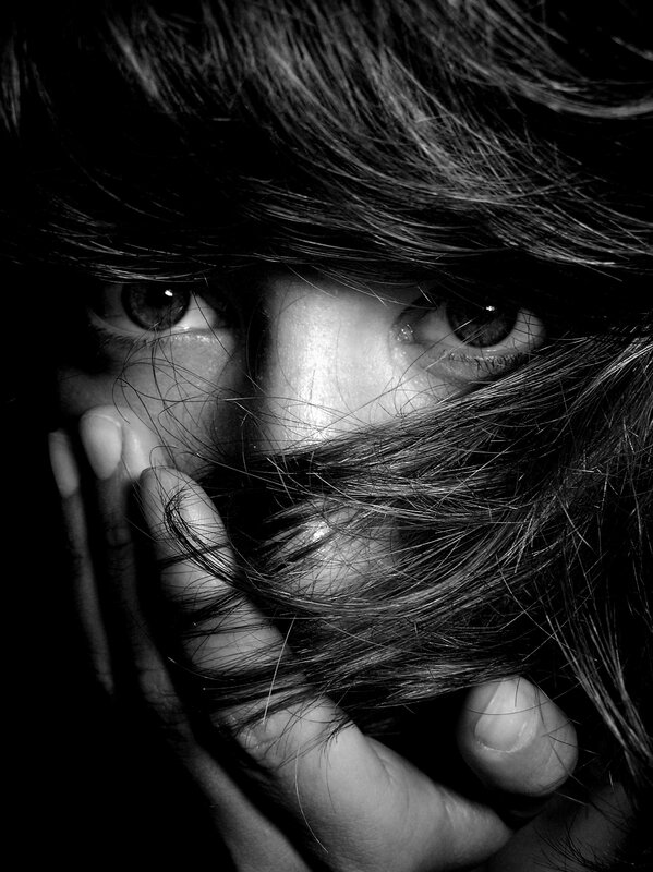 person with hair covering face
