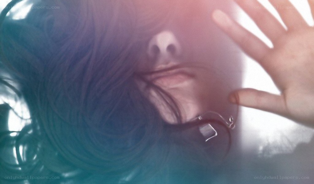 person with hand on glass