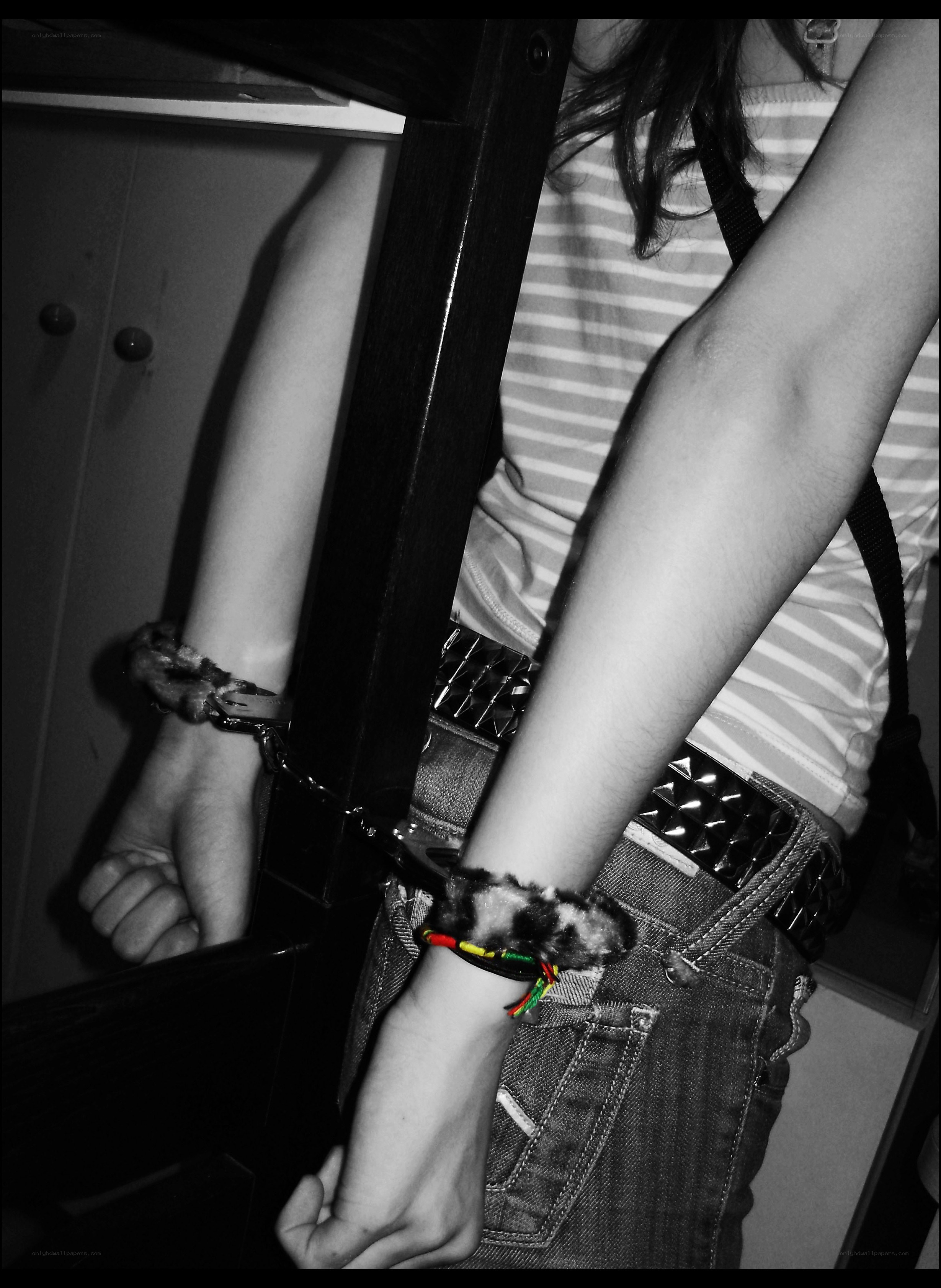 person with handcuffed wrists