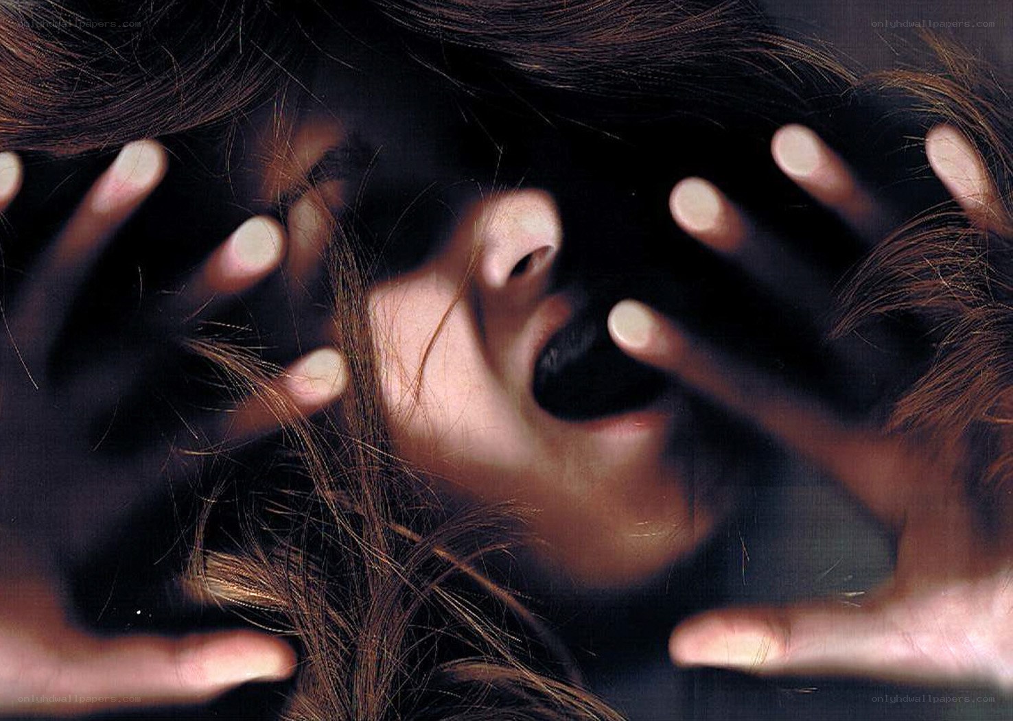 person with hands on face