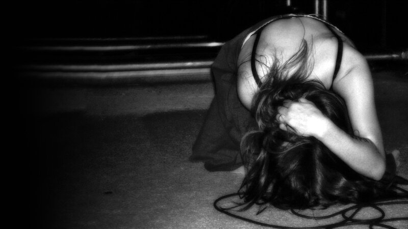 person with head down on floor