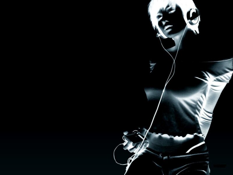 person with headphones and music player