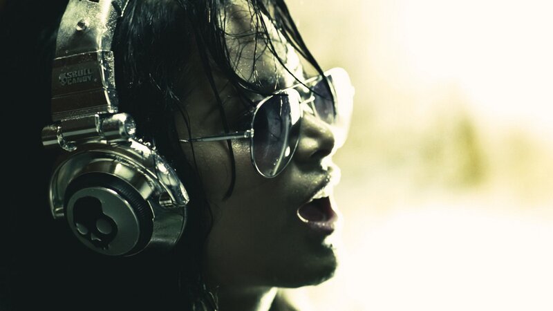 person with headphones and sunglasses