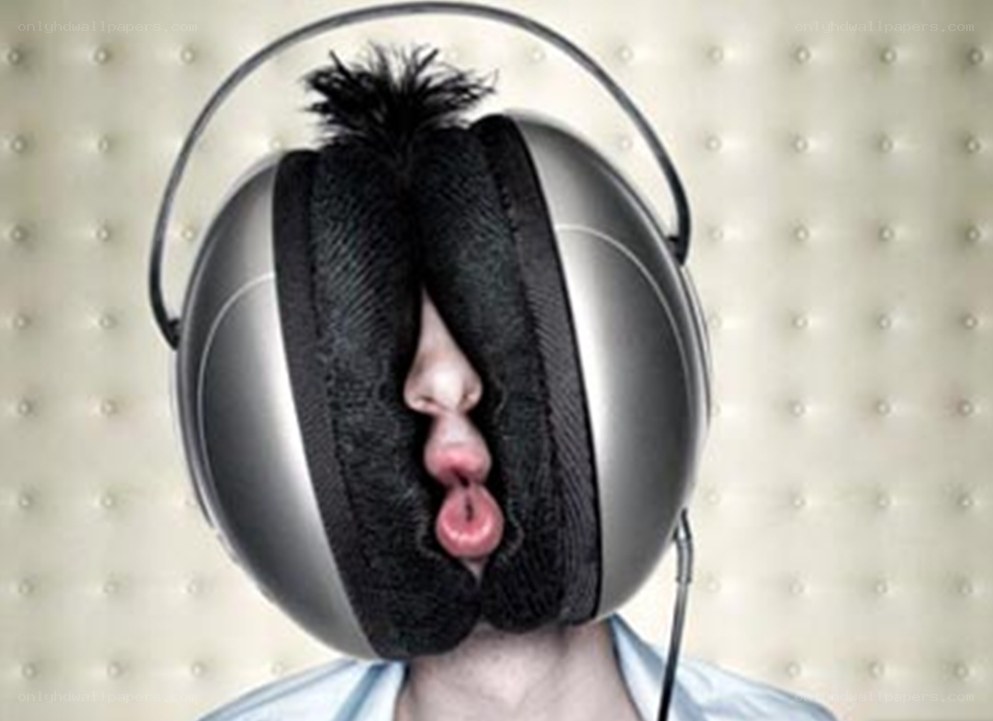person with headphones covering face