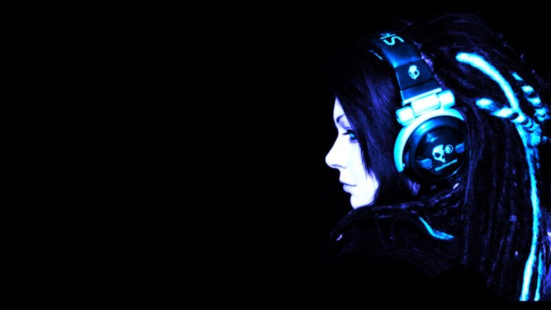 person with headphones in blue light
