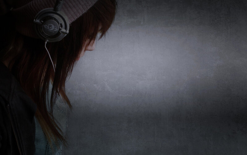 person with headphones in profile
