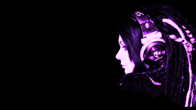 person with headphones in purple light