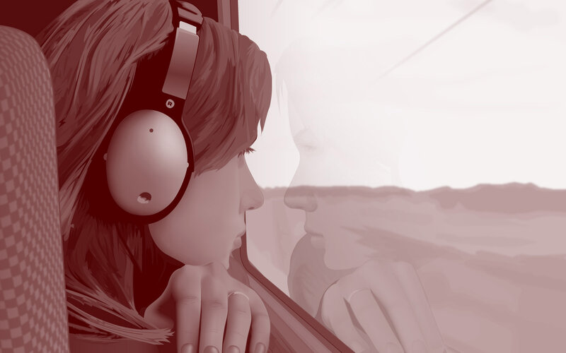 person with headphones looking out window