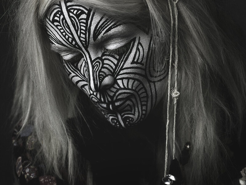 person with intricate face paint