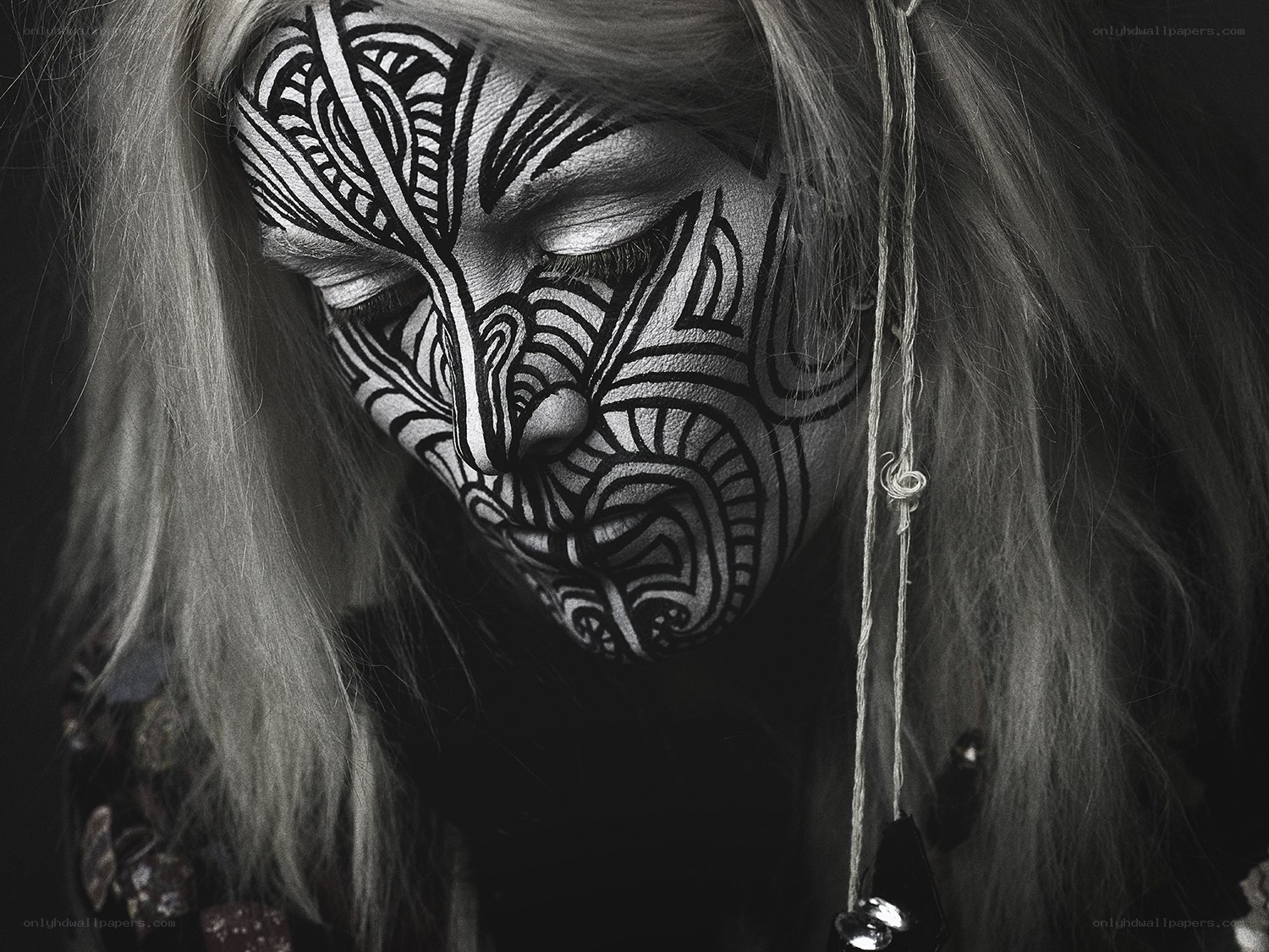 person with intricate face paint