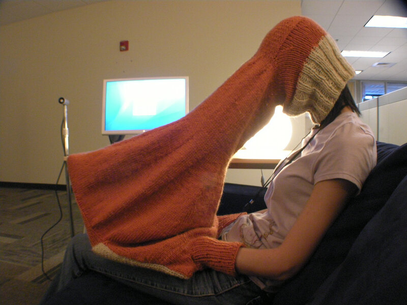 person with knitted hood