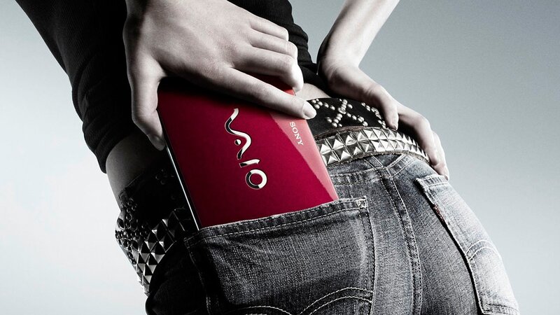 person with laptop in pocket