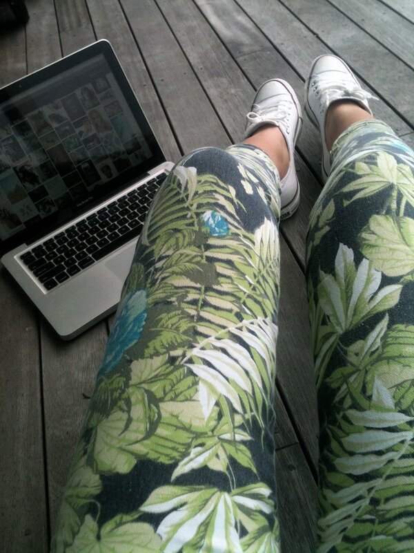 person with laptop on deck