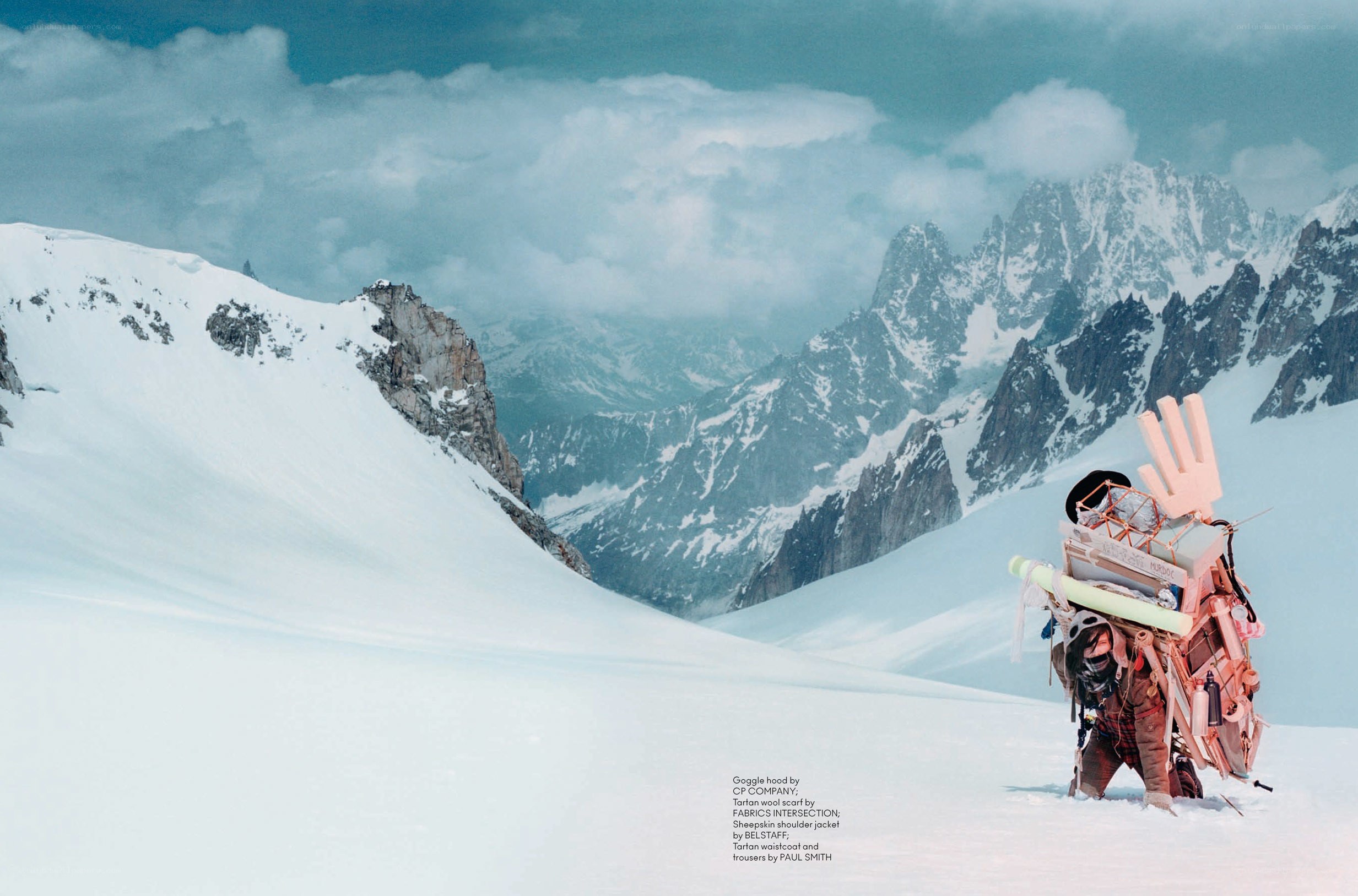 Person with large backpack in snowy mountains