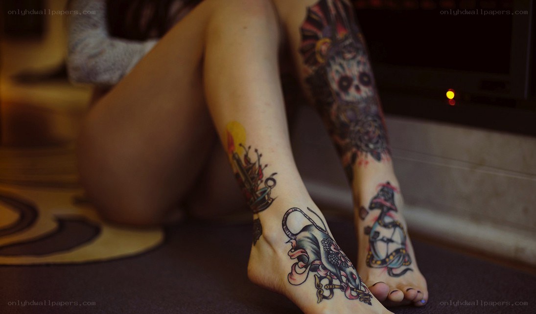 person with leg tattoos