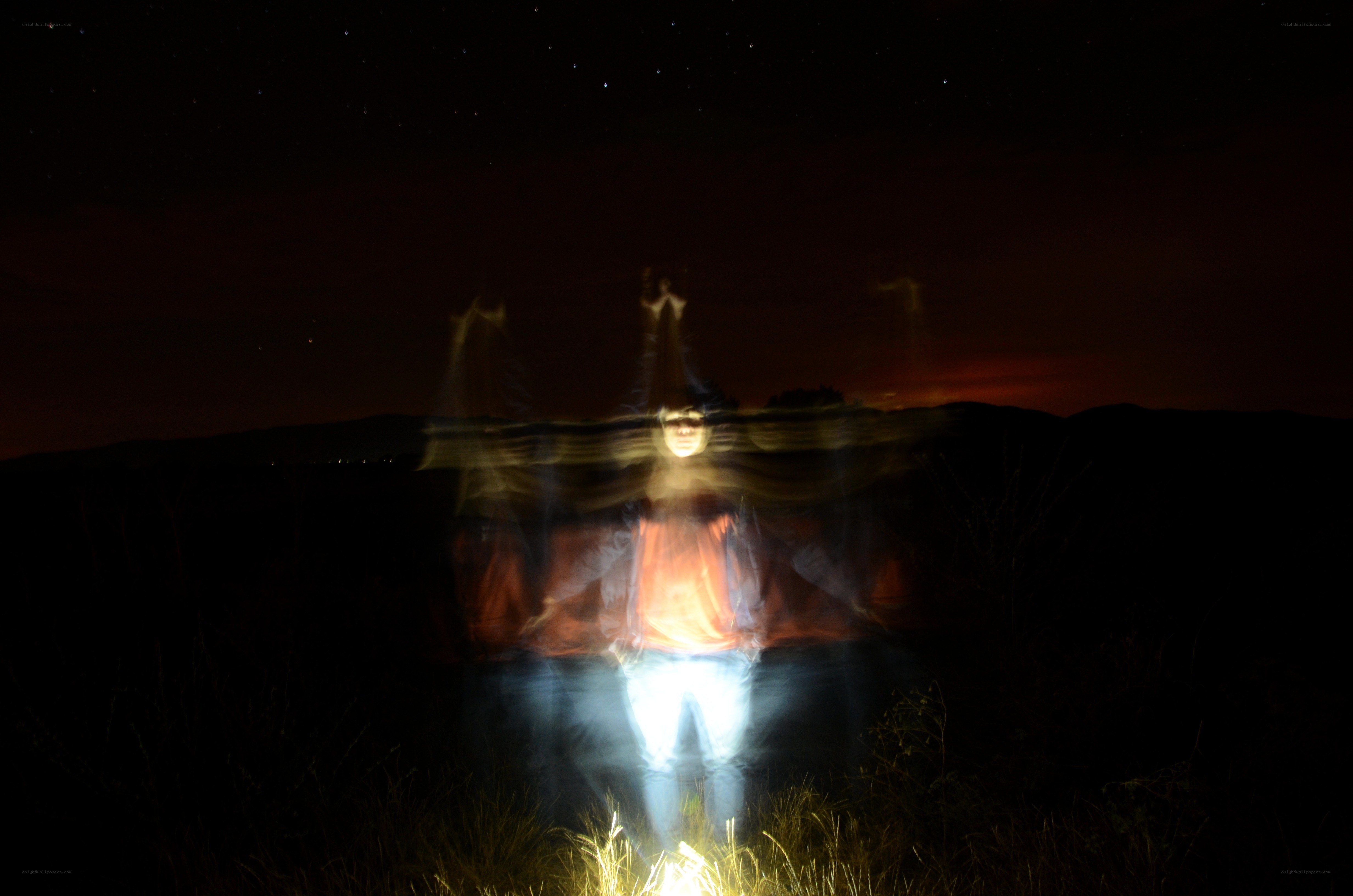Person with light trails at night