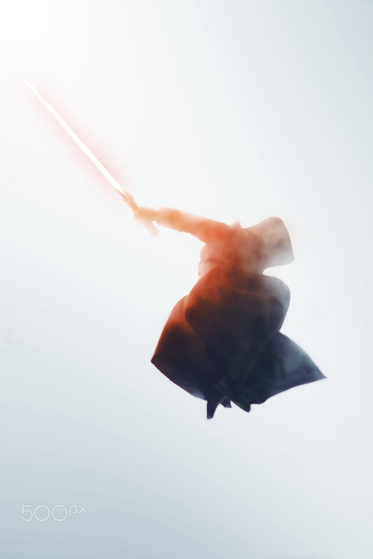 Person with Lightsaber — White