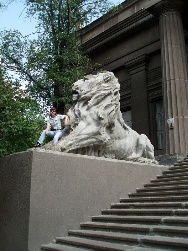Person with lion statue