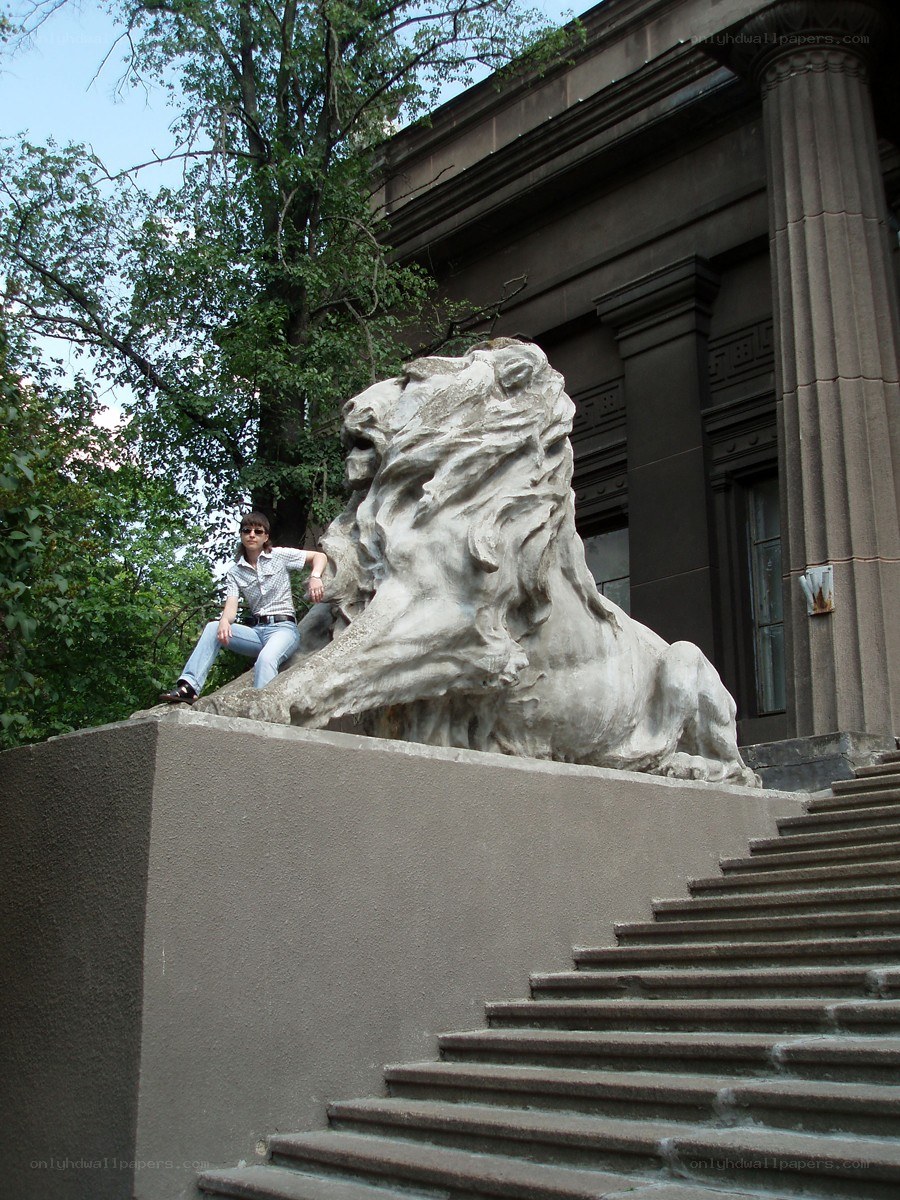 Person with lion statue