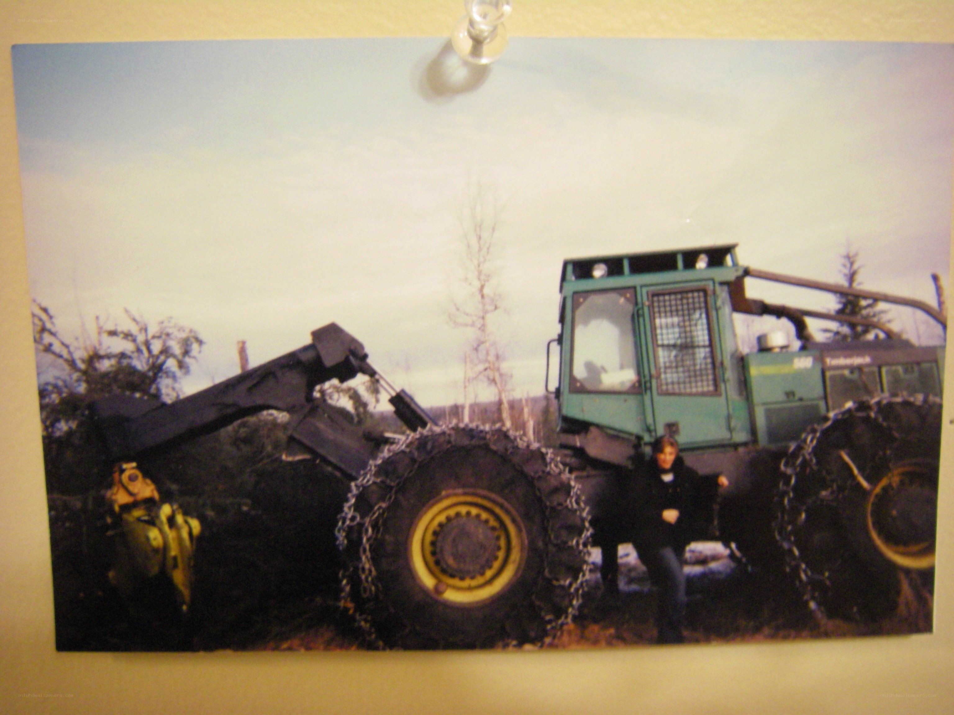 person with logging vehicle