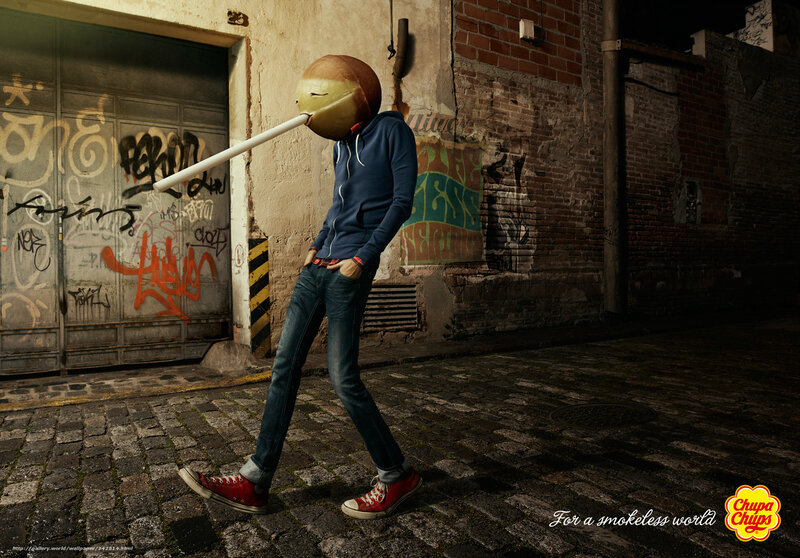 person with lollipop head in alley