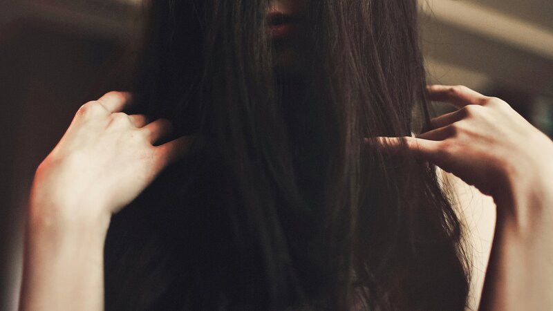 person with long dark hair
