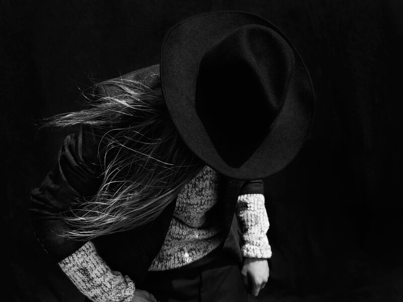 Person with Long Hair — Black, Dramatic, Photograph, Hat