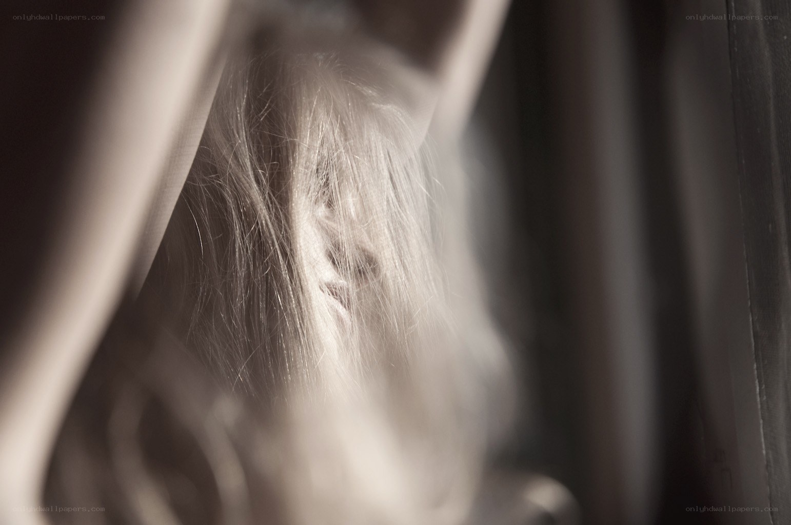 person with long hair in shadow