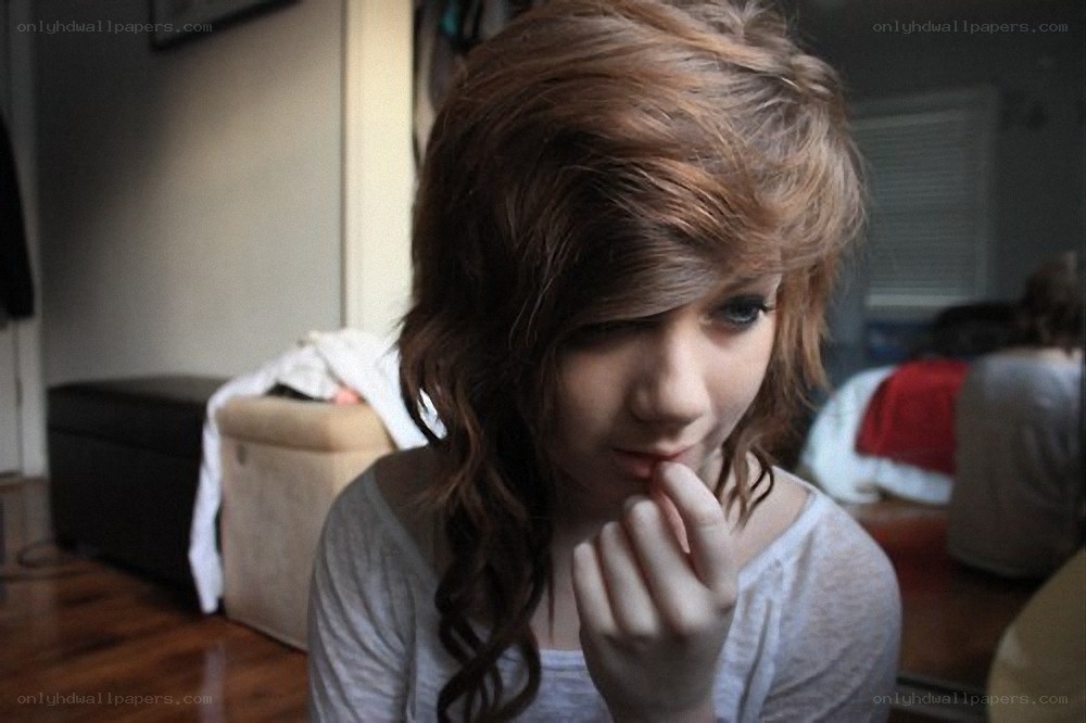 person with long hair looking down