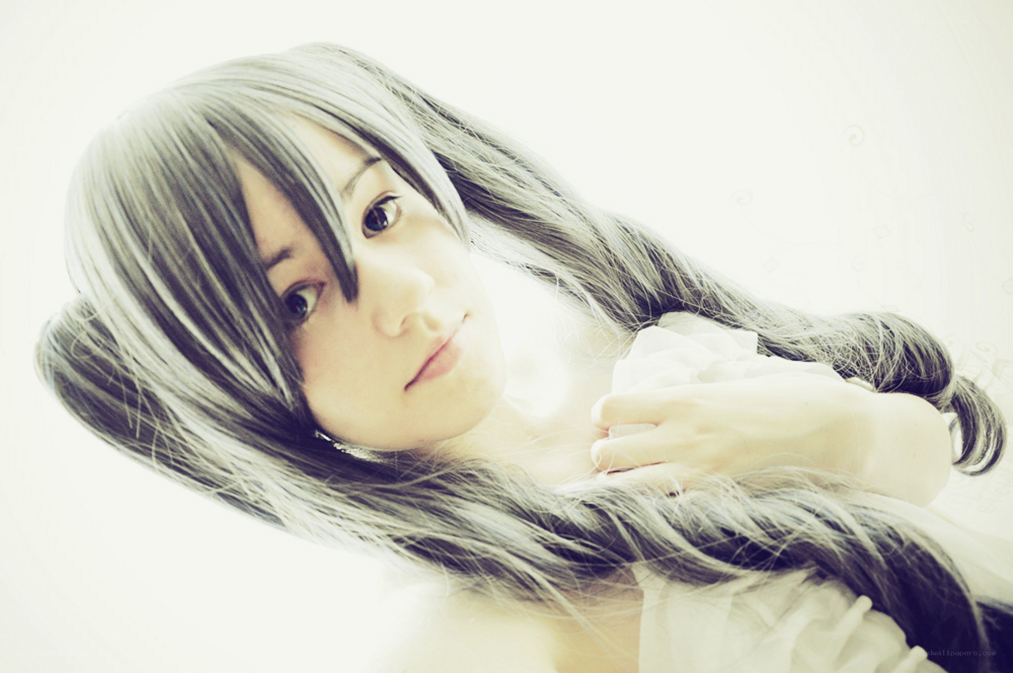 person with long hair lying down
