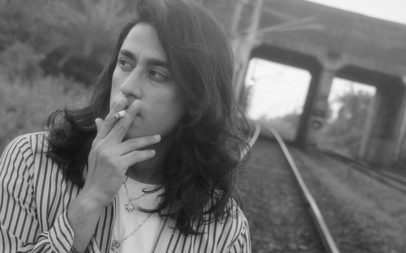 Person with Long Hair Smoking