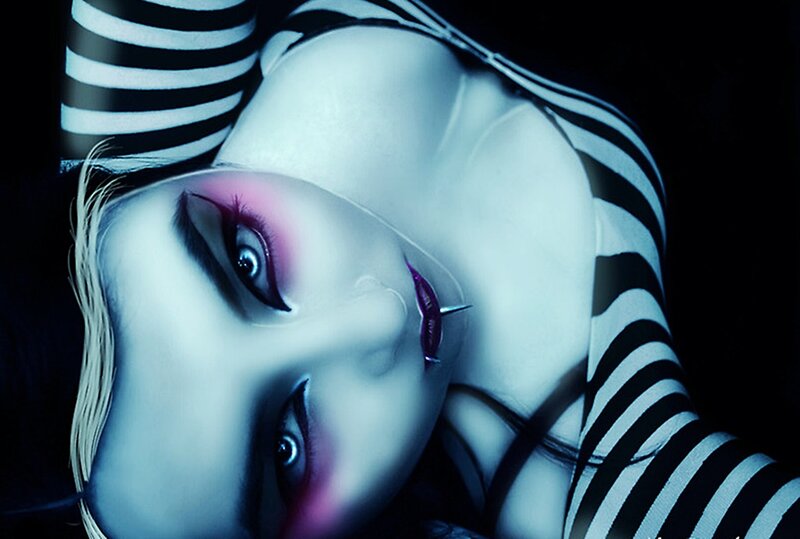 Person with Makeup and Striped Shirt