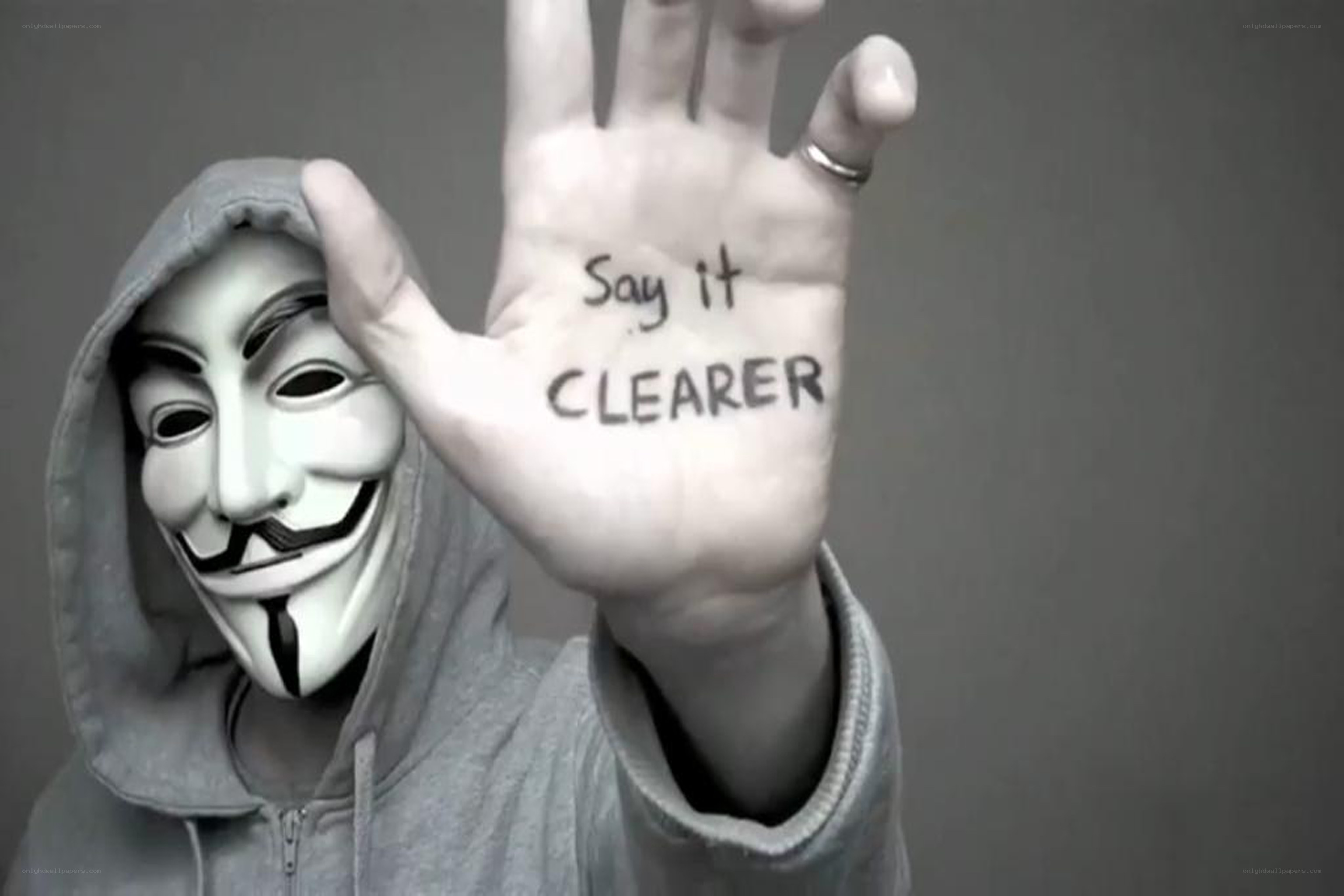 person with mask holding hand