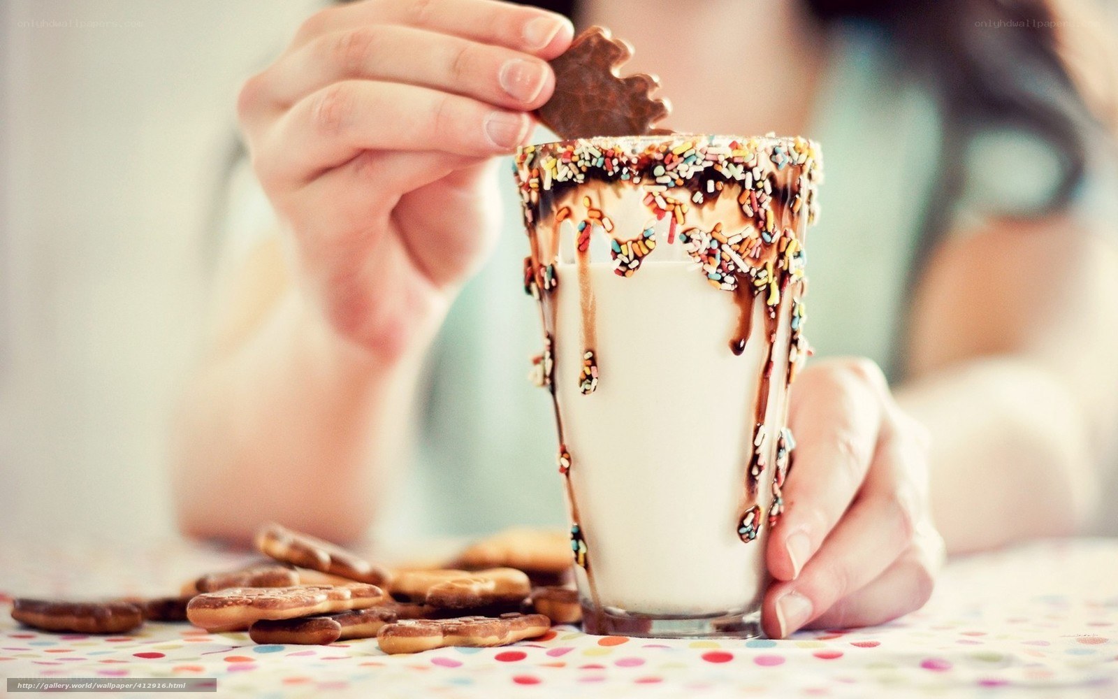 person with milkshake and cookies