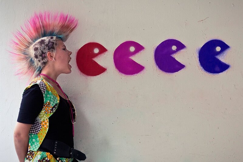 person with mohawk and graffiti