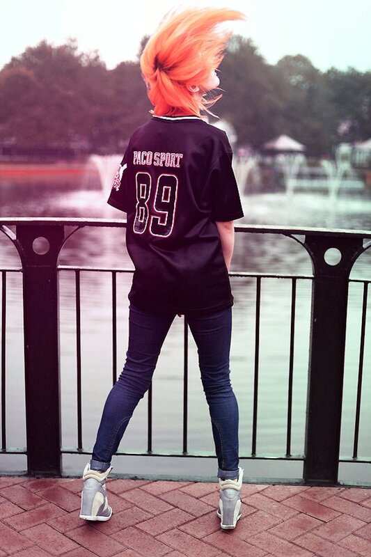 person with orange hair by water