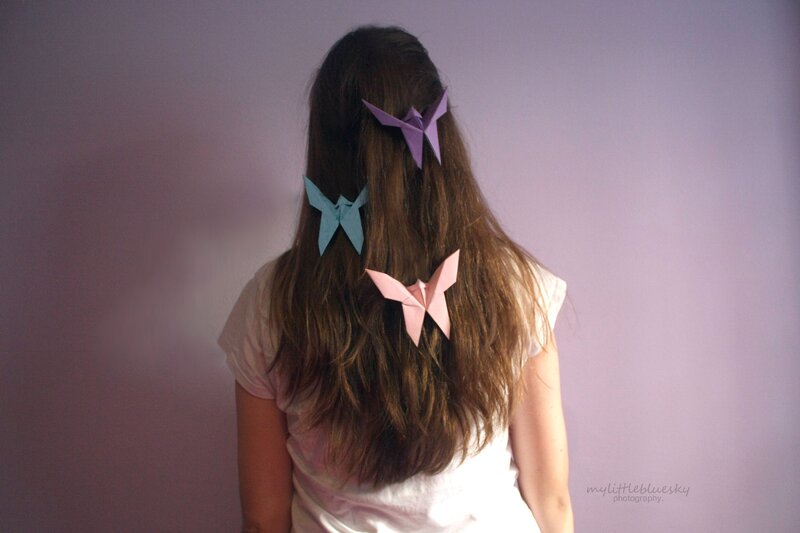 Person with Origami Butterflies