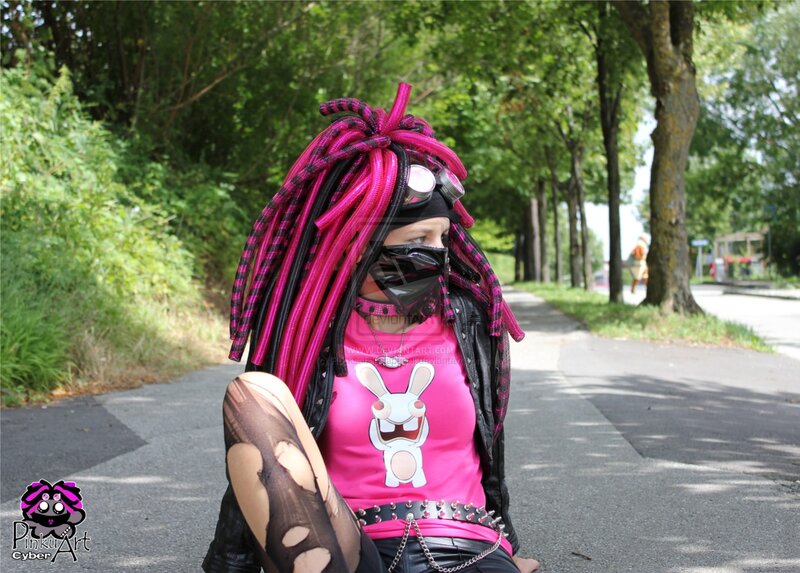 person with pink dreadlocks