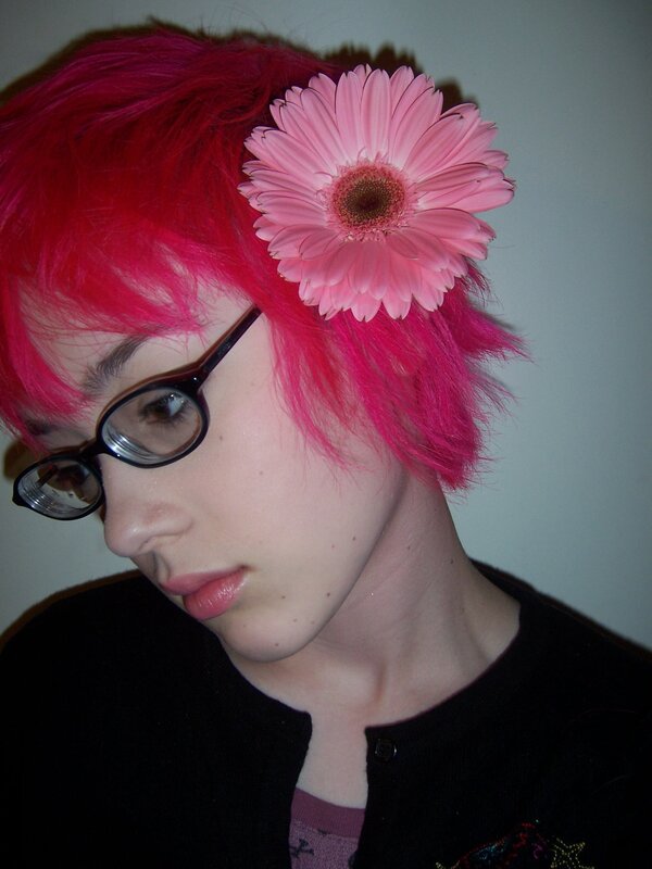 person with pink hair and flower