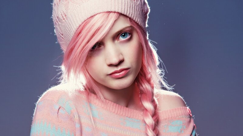 person with pink hair and hat