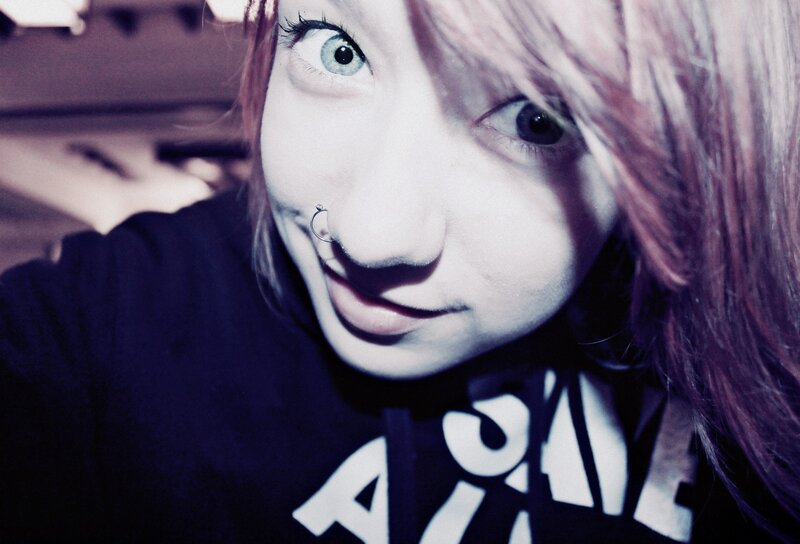 person with pink hair and nose ring